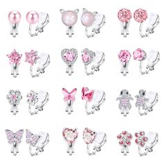 a bunch of different types of rings with flowers and hearts on them, all in pink