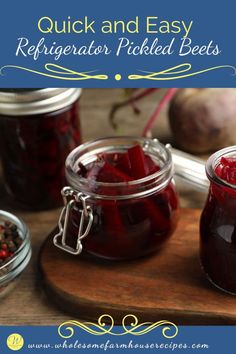 jars filled with pickled beets sitting on top of a wooden cutting board