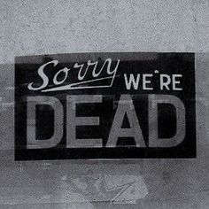 there is a sign that says sorry we're dead