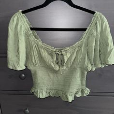 Forever21 Woven Off The Shoulder Top Size : S Color : Olive Never Worn Still With Tag Super Cute Comfortable And Soft Off The Shoulder Tie In The Front Design Smock Material Around The Waist Crop Fitted Casual Blouse By Forever 21, Forever 21 Green Tops For Spring, Casual Cropped Blouse By Forever 21, Forever 21 Casual Cropped Blouse, Chic Green Top From Forever 21, Forever 21 Green Crop Top For Spring, Green Off-shoulder Casual Top, Casual Green Off-shoulder Summer Top, Trendy Green Forever 21 Crop Top