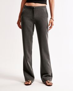 Elevate your wardrobe with the Abercrombie & Fitch Women's Low Rise Tailored Boot Pant, a perfect blend of sophistication and comfort. These pants are designed to flatter, featuring a low-rise cut and bootcut silhouette that enhances your figure.

- Size: 28 SHORT
- Color: Dark Gray
- Material: Pocket Bag - Polyester, Elastane
- Gender: Female
- Features: Slim waistband, functional pockets, zipper closure

Ideal for both office wear and casual outings, these pants offer a clean, tailored look wi Modern Mid-rise Bottoms With Welt Pockets, Workwear Bottoms With Zip Fly And Straight Hem, Classic Mid-rise Pants With Zip Fly, Modern Fitted Straight Bottoms, Fitted Bottoms With Zip Fly And Straight Hem, Straight Fit Bottoms For Workwear, Fitted Bottoms For Work With Standard Cut Leg, Fitted Bottoms With Zip Fly And Standard Cut Leg, Modern Mid-rise Workwear Bottoms