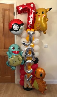 the balloons are arranged in the shape of letters and pokemon characters, including pikachu