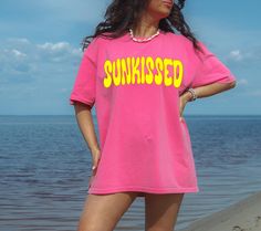 Comfort Colors Sunkissed Summer Shirt. Oversized beach shirt, pool party tee, beach party shirt, Cruise shirt for women.  Preppy clothes for teens. Cute summer tops for teens. Gift for her.  Comfort Colors T-shirts. SIZES: S, M, L, XL, 2X, 3X,4X COLORS:  Crunchberry, Chambray, Lagoon Blue, Violette, Citrus, Blossom,  White, Ivory. If you see another color you like on a Color chart contact us to see if color is available in your size. Comfort Colors 1717 t-shirts are very popular and sell out fast.  DETAILS: *(6.1 oz/yd² (206.8 g/m high quality, 100% ring-spun US cotton for long-lasting comfort *Relaxed fit *Pre-shrunk fabric *Crewneck style HOW TO CHOOSE THE SIZE: Follow the Size Chart provided for measurements. All measurements are of the garments, not the person. To find your perfect siz Trendy Pink Tops For Beach Party, Trendy Pink Top For Beach Party, Oversized Pink Top For Beach, Trendy Short Sleeve Top For Poolside, Trendy Tops For Poolside Vacation, Trendy Tops For Poolside And Beach Season, Trendy Crew Neck Top For Poolside, Relaxed Fit Pink Top For Beachwear, Pink Relaxed Fit Top For Beachwear