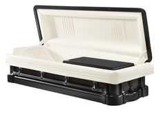 an empty black and white casket with its lid open