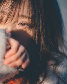 a close up of a person holding something in their hand