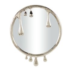 a round mirror with three drops hanging from it