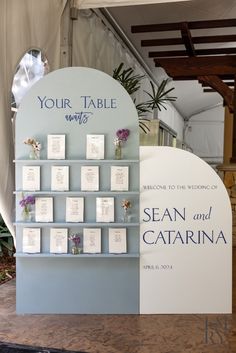 a table display with cards and flowers on it