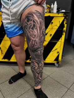 a man with a tattoo on his leg