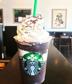 a starbucks drink with whipped cream and chocolate