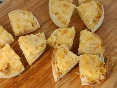 several pieces of bread that are on a cutting board