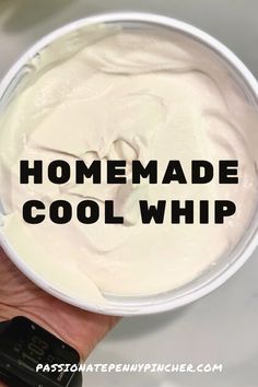 a hand holding a white container with the words homemade cool whip in black lettering on it