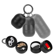 an assortment of black and white objects including two ear plugs, one with a ring