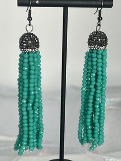 These earrings will add just the right sparkle to your outfit, and the turquoise beads create an interesting look. They go well with most necklines and dress styles, and the stone beads will look and feel amazing. Turquoise Dangle Tassel Earrings For Party, Turquoise Jewelry With Tassels And Round Beads, Elegant Turquoise Earrings With Dangling Beads, Turquoise Tassel Earrings With Round Beads, Turquoise Earrings With Tassels And Round Beads, Turquoise Jewelry With Dangling Beads For Party, Elegant Turquoise Earrings With Tassels, Party Jewelry With Turquoise Dangling Beads, Elegant Turquoise Beaded Dangling Earrings