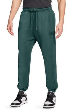 A woven Jumpman patch brings heritage sporty style to these closet-staple sweatpants crafted from cozy brushed cotton fleece. 30" inseam; 9 1/2" leg opening; 13" front rise; 16 1/2" back rise (size Medium) Elastic/drawstring waist Side-seam pockets; back welt pocket 100% cotton Machine wash, tumble dry Imported Nike Cotton Joggers For Loungewear, Comfortable Nike Cotton Pants, Nike Casual Sweats For Leisure, Nike Casual Sweatpants For Loungewear, Nike Cotton Sweats With Elastic Waistband, Nike Cotton Sweats For Jogging, Nike Cotton Joggers, Nike Casual Joggers For Leisure, Nike Casual Relaxed Fit Joggers