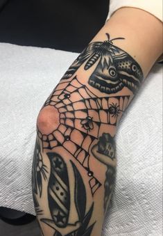 a person with a spider web tattoo on their arm