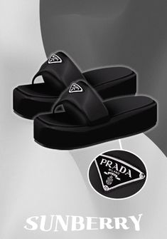 a pair of black sandals sitting on top of a white table next to an advertisement for prada