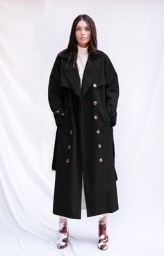 Update your trench game with our Mary Trench Coat. Made of 100% cotton, this trench comes in a relaxed fit perfect for those days when you need to run out the door and still look put together. Featuring exaggerated double notch lapel, with double breasted silhouette, waist belt and button cuff tabs, the Mary Trench Coat will elevate even the most basic of outfits. This sustainable trench coat is tailor made and on demand. It takes us 6 hours to make this trench coat. Check out the pricing transp Cotton Long Coat With Double Button Closure, Oversized Double-breasted Outerwear With Belted Cuffs, Oversized Belted Outerwear With Lapel Collar, Oversized Belted Cotton Outerwear, Spring Oversized Double-breasted Pea Coat, Fall Cotton Outerwear With Belted Cuffs, Smooth Jazz Music, Cotton Trench Coat, Look Put Together