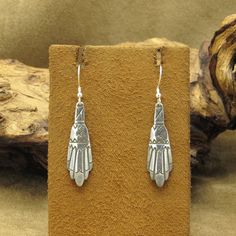 Add a touch of Western flair to your jewelry collection with these vintage dangle earrings. Made with sterling silver, these earrings feature a unique design that showcases the rich cultural heritage of the region. The earrings measure 2" tall including the hook by 7/16" wide. There is no artist's hallmark or stamps on the earrings. The intricate details make these earrings a must-have for any jewelry enthusiast. If you want to showcase your love for Southwestern art, these earrings are the perf Southwestern Art, Tucson Az, Etsy Earrings Dangle, Cultural Heritage, Silver Jewellery, Tucson, Intricate Details, Vintage Sterling Silver, Vintage Looks