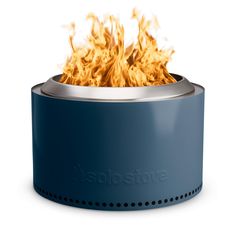 a blue fire pit sitting on top of a white table