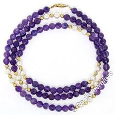 This unique and lovely looking necklace features 94 round, genuine, amethyst beads separated by 8 stations which are each comprised of 2 round cultured pearls and 3 petite solid 14k yellow gold beads. The amethysts display very desirable and naturally varying shades of rich purple color. The pearls add a soft and elegant touch to the design with their grayish-ivory color and wonderful luster. The clasp is finely crafted from solid 14k yellow gold and features fine milgrain work and etched detail Amethyst Single Strand Jewelry With Round Beads, Purple Necklace With Polished Round Beads, Purple Amethyst Round Beads Necklace, Elegant Purple Multi-strand Beaded Necklaces, Elegant Multi-strand Purple Beaded Necklaces, Blue Moonstone, Amethyst Beads, Strand Necklace, Cultured Pearls