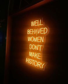 a neon sign that says well behaved women don't make history