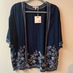 Navy Blue, Embroidered Flower, Short Sleeve, Woven Kimono Cardigan. 23 In. Shoulder Hem To Shoulder Hem 24 In. From Collar To Bottom Hem 8.5 In. Sleeve Length Blue Open Front Top For Spring, Blue Kimono, Vintage Kimono, Kimono Cardigan, Embroidered Flowers, Sweaters & Cardigans, Kimono Top, Sweaters For Women, Navy Blue