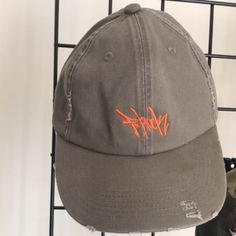 Introducing The F-Rock Clothing Distressed Dad Hat In Army Green With Orange Accents. This Unisex Adults Hat Is Perfect For All The Fashionable Dads Out There Who Want To Rock Stylish Yet Comfortable Headwear. Made With 100% Cotton Material, This Hat Is Perfect For Casual Outings Or Daily Errands. Its Unique Style And Design Make It Suitable For Both Men And Women. The F-Rock Clothing Brand Ensures Quality And Durability, Making It A Great Addition To Your Hat Collection. Distressed Dad Hat For Streetwear, Casual Distressed Dad Hat For Streetwear, Casual Distressed Flat Brim Hats, Urban Dad Hat For Summer Streetwear, Casual Gray Baseball Cap With Short Brim, Urban Summer Dad Hat For Streetwear, Gray Short Brim Baseball Cap Casual, Trendy Brown Hats For Streetwear, Trendy Brown Hat For Streetwear