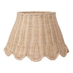 a wicker lamp shade with scalloped edges