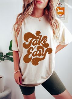 "Take It Easy Retro Oversized TShirt, Comfort Colors Tshirt, Graphic Tees For Women, Boho Shirt, Take It Easy Crewneck, Motivational T Shirts Whether you're hitting the road for a cross-country adventure or just hanging out with friends, you'll love its comfortable, oversized fit with this Comfort Colors shirt. The mineral wash feel is super soft and perfect for any casual occasion. Rock this tee with your favorite jeans or leggings and you'll look great no matter what. This is a standard unisex Scary Movie Shirts, Horror Movie Shirts, Movie Tees, Movie Shirts, Coffee Shirts, Thanksgiving Shirts, Dye Shirt, Vintage Graphic, Christmas Tees