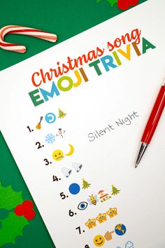 a christmas song emotriva sheet next to a pen and candy canes