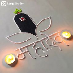 a sign that has some candles in front of it with the word india written on it