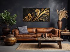 a living room with leather couches and potted plants on the table in front of it