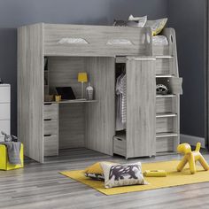 a child's bedroom with bunk bed, desk and storage space for toys on the floor