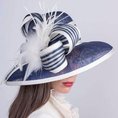 Navy blue Kentucky Derby hat, Royal Ascot extra wide brim hat. This hat is made from high quality navy blue sinamey with an astonishing decoration of ivory feathers and ivory and dark blue stripes abaca silk fabric. The wide brim make it really special and suits almost all face types. The hat is hand blocked on a wooden block and hand stitched to perfection at Irina Sardareva millinery atelier. It is great to wear on Derby races, Royal Ascot, Cocktail parties, Weddings, Tea parties, etc. This gorgeous hat is MADE TO ORDER! We need 1-2 weeks to make it.  ♠  MATERIALS: Base: Simamey Ribbon stripes: silk and abaca Feathers ♠  COLORS:  This hat is available: - in dark blue base with ivory decoration; - in natural cream color base with black decoration - in Black base with ivory decoration - in Audrey Hepburn Hat, Derby Attire, Edwardian Hat, Derby Ideas, French Beret Hat, Royal Ascot Hats, Sinamay Hats, Ascot Hats, Hat Wedding