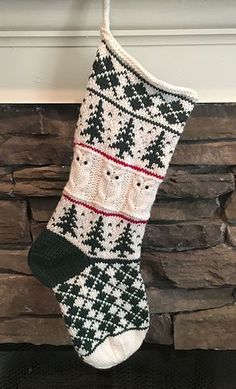 a knitted christmas stocking hanging from a fireplace