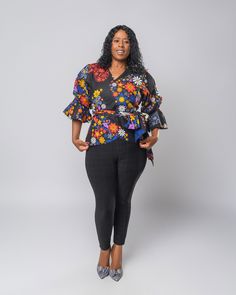 Chido Floral Top Introducing our vibrant and stylish long  Bell-Sleeved Wrap Floral Ankara Top! 🌺🎀 Get ready to stand out in this eye-catching and colorful African-inspired ankara top. The moment you slip it on, you'll feel a burst of energy and confidence! 🌟 Versatile Style: Whether you're heading to a casual brunch, a fun weekend getaway, or a stylish night out with friends, this ankara top effortlessly elevates your look. Pair it with jeans, skirts, or shorts for an instant pop of color and flair. 🌻 Handmade with Love: Each top is lovingly handmade by skilled artisans, adding a touch of craftsmanship and authenticity to your wardrobe. Top has long attached wrap belt or you can pair it with your own belt. Note: As each top is made from unique ankara fabric, patterns and colors may va Multicolor Floral Print Top With Kimono Sleeves, Fitted Blouse With Vibrant Print, Fitted Blouse With Kimono Sleeves For Spring, Fitted Long Sleeve Blouse With Bold Print, Vibrant Long Sleeve Fitted Top, Vibrant Fitted Long Sleeve Tops, Floral Wrap Top, Wrap Belt, Ankara Fabric