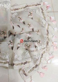 Exclusive Boutique Designer Muslin Saree: Deshi Besh. White Organza Blouse With Floral Embroidery, White Tissue Silk Dupatta With Floral Embroidery, White Floral Embroidered Tissue Silk Dupatta, White Silk Thread Saree, Designer White Organza Saree, Designer White Saree With Floral Embroidery, White Organza Saree With Floral Embroidery, White Floral Embroidery Saree For Eid, White Silk Thread Dupatta