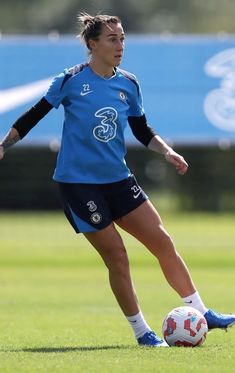 a female soccer player in action on the field