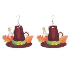 a pair of earrings with a hat on it