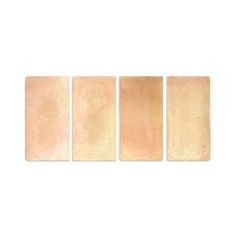 four pieces of beige tile on a white background