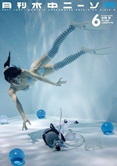 a woman diving in the water with bubbles around her and an object on the ground