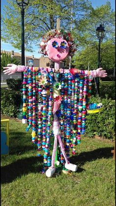 a costume made out of plastic bottles and beads