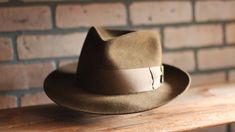 Handcrafted fedora inspired by the hat worn by Chris Cooper in Seabiscuit Originally custom made by Baron Hats Custom made to order, please allow 8-12 weeks for delivery. Store credit or exchange only. Crown: 4" Brim: 2.5" Color: Chocolate Brown Hatband: 2" chocolate brown grosgrain ribbon w/gentleman's bow * Disclaimer: "Seabiscuit", is TM and © (or copyright) by DreamWorks Pictures, Spyglass Entertainment, The Kennedy/Marshall Company, and Larger Than Life Productions. Any reproduction, duplic Chris Cooper, Fedora Hat Style, Los Angeles Street, Mens Hats Fashion, Mens Hats, Hats Fashion, Straw Fedora, Classic Hats, Color Chocolate