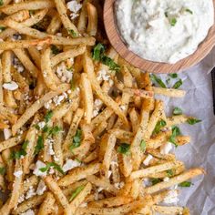 french fries and dip on a table