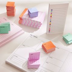 several different colored sticky notes on top of each other