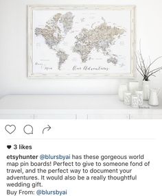 a white shelf with vases and a map on the wall above it that says 3 likes