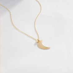 "Time to show your love is to the moon and back. Love yourself or gift her with a 14k gold moon necklace. A birthday, Galentine's day or just a lucky Friday is the perfect gifting day. F E A T U R E S * Made to Order. * Gold KT: 14K * Choice of Gold Color: Yellow Gold, Rose Gold, White Gold * Gem Stone: Genuine Diamond * Diamond-Cut: Round * Diamond Carat: 0.01 ct * Pendant Height: 15.5 mm / 0.61 inch * Pendant Width: 9 mm / 0.35 inch * Diamond Color-Clarity: H Color, SI Clarity * Length: 14\", Minimalist 14k Gold Moon Jewelry, Minimalist Moon Shaped Jewelry In 14k Gold, Minimalist Moon Shaped 14k Gold Jewelry, Minimalist Yellow Gold Moon Necklace, Minimalist Yellow Gold Half Moon Jewelry, Minimalist Moon Shaped Jewelry For Anniversary, Minimalist Moon-shaped Jewelry For Anniversary, Minimalist Yellow Gold Moon Jewelry, Minimalist Rose Gold Moon-shaped Jewelry