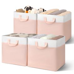 three pink storage bins with stuffed animals in them