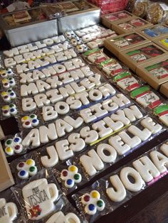 there are many decorated cookies on display for sale at the store's counter top