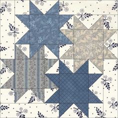 a blue and white quilt with stars on it